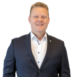 Porträt von Lutz Niederheide im dunkelblauen Anzug, Ansprechpartner für exklusive Kapitalanlageimmobilien.
